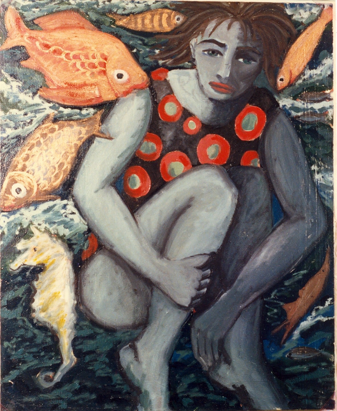 Niña con caballito de mar